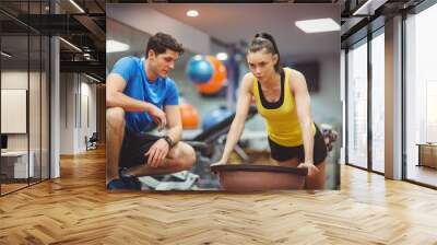 Fit woman working out with trainer Wall mural