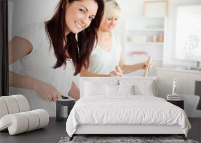 Gorgeous young Women preparing dinner Wall mural