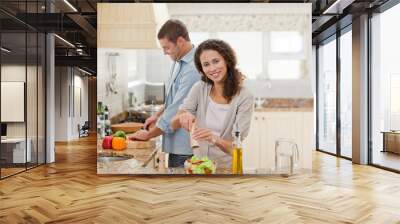 Handsome man cooking with his girlfriend Wall mural