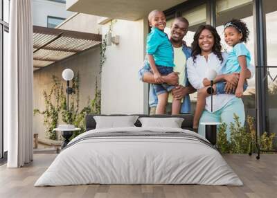 Happy african american family standing in the garden  Wall mural