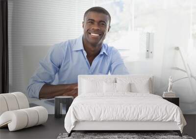 happy businessman working at his desk Wall mural