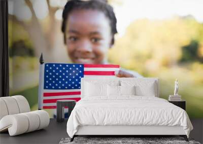 Happy child showing a usa flag Wall mural