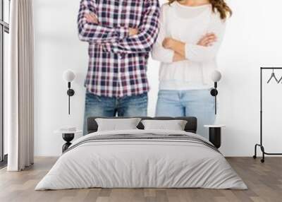 Happy couple standing with arms crossed Wall mural