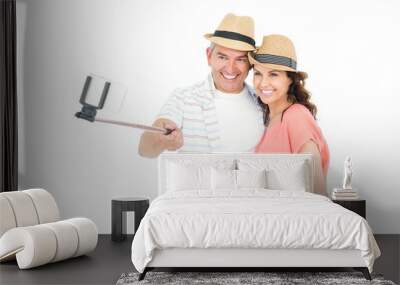 happy couple using a selfie stick Wall mural