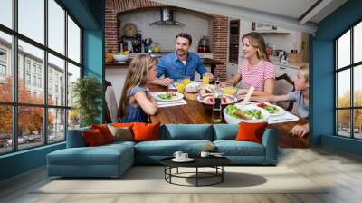 happy family talking to each other while having meal in kitchen Wall mural