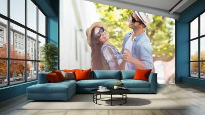 Happy young couple dancing Wall mural