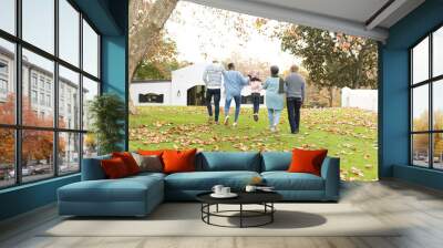 Image of back view of multi generation african american family having fun outdoors in autumn Wall mural