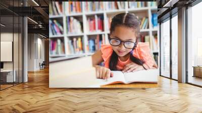 Little girl reading a book Wall mural