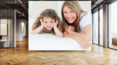 little girl with her grandmother looking at the camera Wall mural