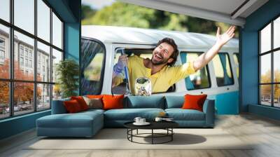 Man looking out of camper van window Wall mural