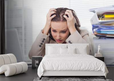 Nervous businesswoman pulling her hair out Wall mural