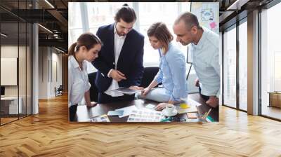 Photo editors using digital tablet in meeting room Wall mural