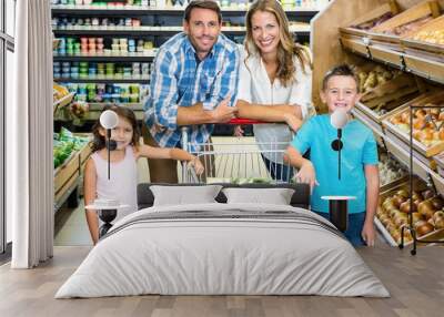 Portrait of family doing shopping  Wall mural