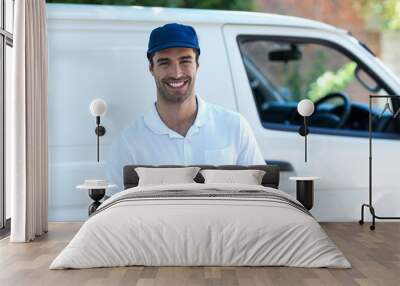 Portrait of happy delivery man with clipboard  Wall mural