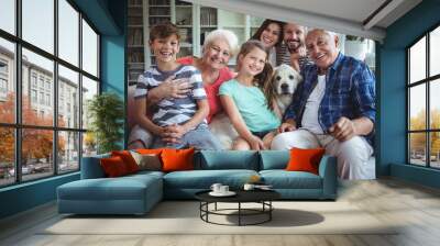 Portrait of happy family sitting on sofa  Wall mural