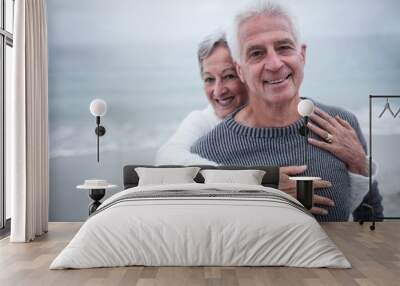 Portrait of happy senior couple embracing each other  Wall mural