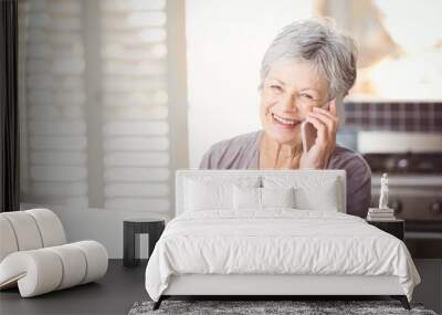 Portrait of happy senior woman talking on mobile phone Wall mural