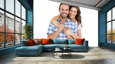 Portrait of happy young couple embracing on white background Wall mural