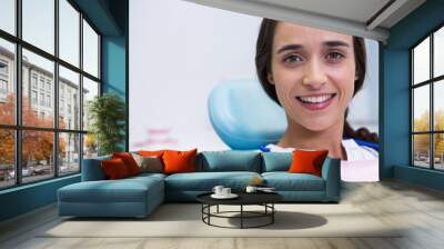 Portrait of patient smiling at dental clinic Wall mural