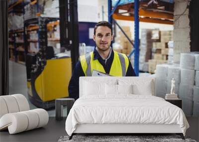 portrait of warehouse worker with clipboard Wall mural