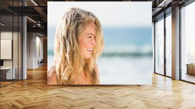 Portrait of woman on the beach Wall mural