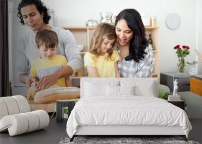 Positive family preparing lunch together Wall mural