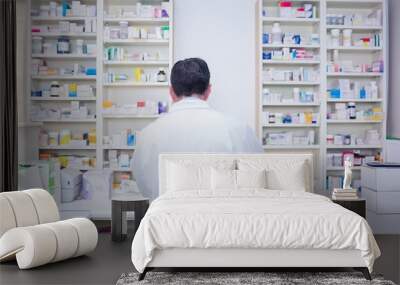 rear view of a pharmacist working in lab coats Wall mural