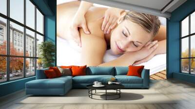 Relaxed smiling woman receiving a back massage Wall mural