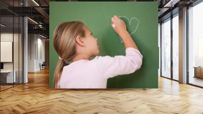 Schoolgirl drawing a heart Wall mural