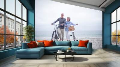 Senior couple having ride with their bike Wall mural