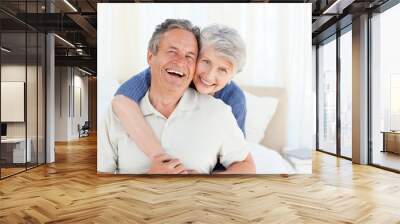 Senior couple looking at the camera Wall mural