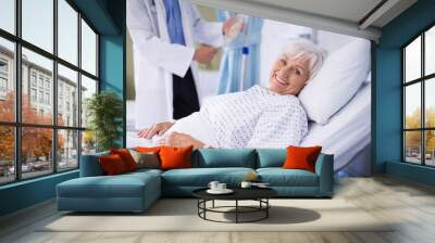 senior patient lying on a bed Wall mural