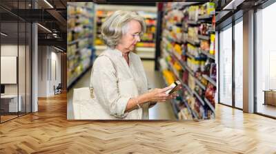 senior woman buying food Wall mural