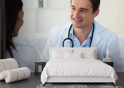 smiling doctor giving a prescription to his female patient Wall mural