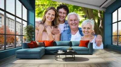 Smiling family hugging Wall mural