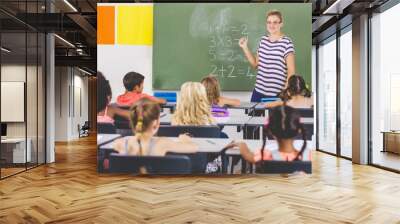 Teacher teaching mathematics to school kids in classroom Wall mural