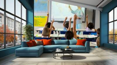 Teacher teaching schoolchildren using projector screen  Wall mural