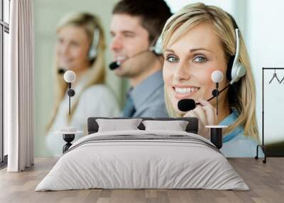 three businesspeople working with headsets Wall mural