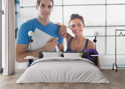 Trainer with a brunette woman Wall mural