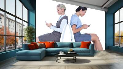 two businesswomen using smartphone Wall mural