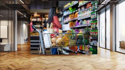 various groceries in shopping cart Wall mural