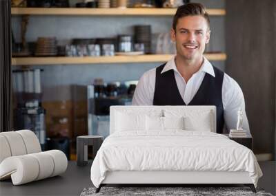 Waiter holding digital tablet in restaurant Wall mural