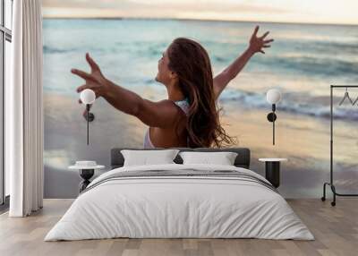 Woman stretching out her arms Wall mural