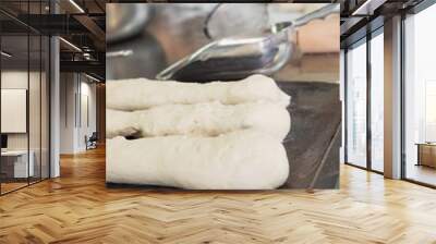 Worktop with uncooked baguettes and breads Wall mural