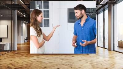 Young couple arguing in kitchen Wall mural