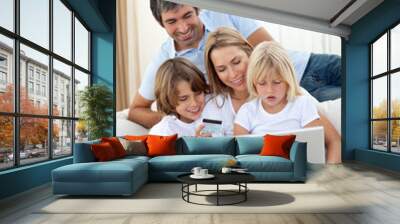 Young family shopping online Wall mural