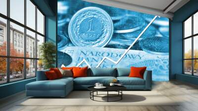 Arrow graph going down and polish currency in background Wall mural