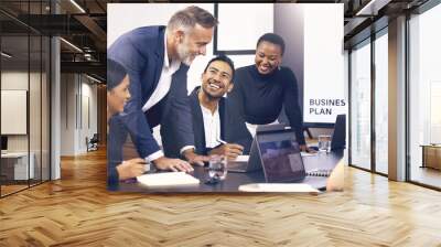 Collaboration, meeting and planning with a business team laughing in the boardroom during a strategy workshop. Diversity, teamwork and funny with a group of colleague in the office for brainstorming Wall mural