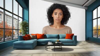 attractive upset young dark skinned lady with afro hairstyle feeling sad or bored expression while s Wall mural