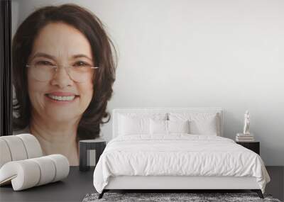 close up portrait of a senior attractive middle-aged brunette woman with a beautiful smile relaxing  Wall mural